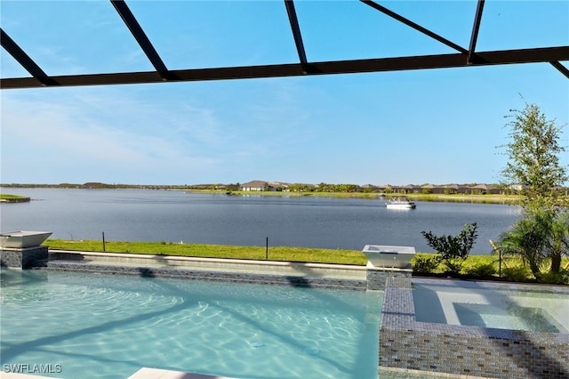 view of pool with glass enclosure and a water view