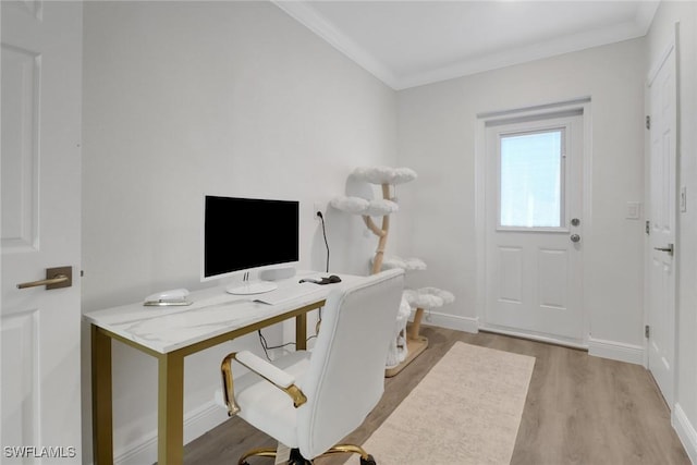 office area with crown molding, baseboards, and wood finished floors