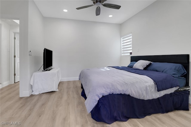 bedroom with light wood finished floors, baseboards, and recessed lighting