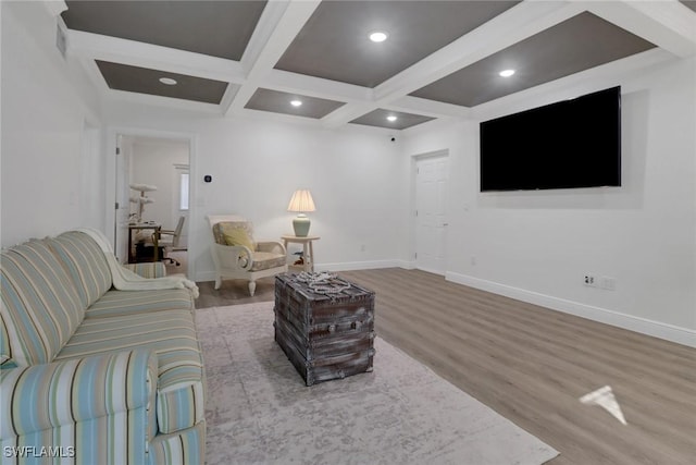 living room featuring beam ceiling, coffered ceiling, baseboards, and wood finished floors