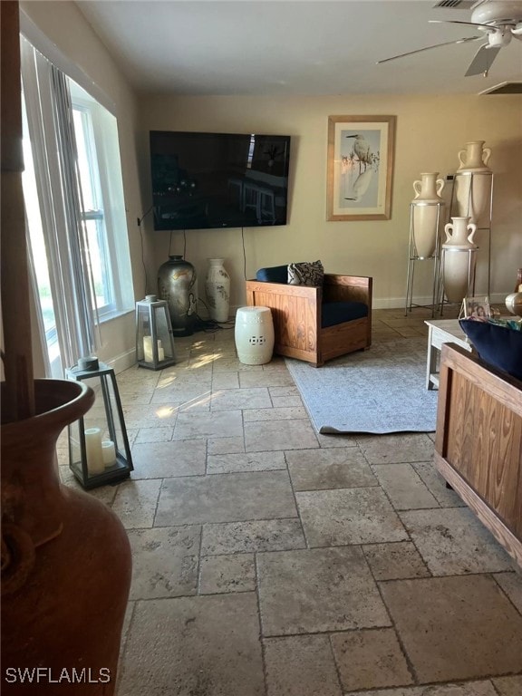 living room featuring ceiling fan