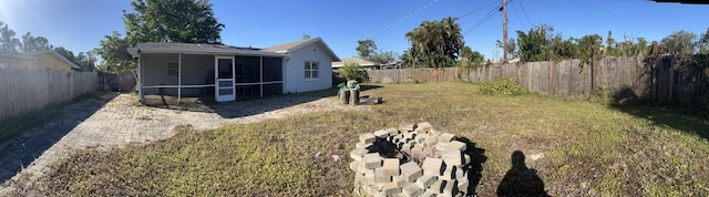 view of yard with a sunroom