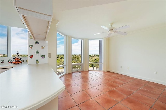 entryway featuring ceiling fan, light tile patterned floors, and a wall of windows