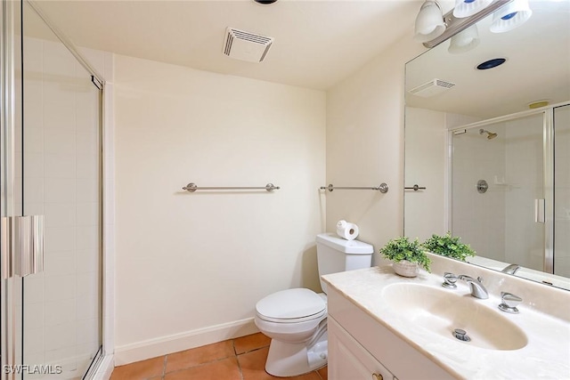 bathroom with tile patterned floors, vanity, toilet, and a shower with shower door