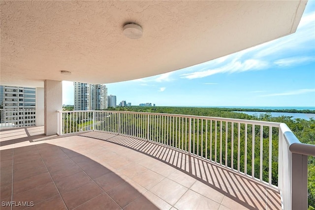 balcony featuring a water view