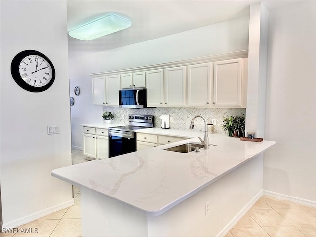 kitchen with sink, decorative backsplash, light tile patterned flooring, kitchen peninsula, and stainless steel appliances