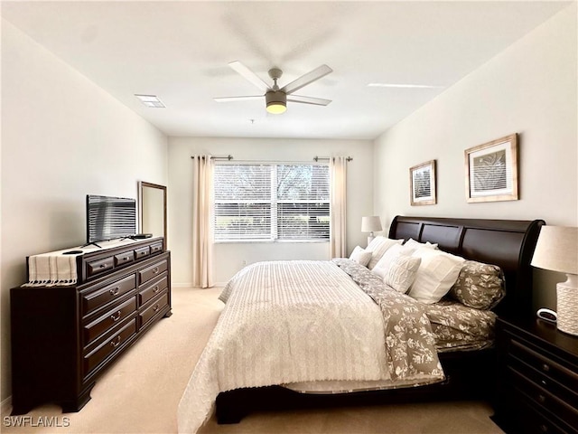 bedroom with ceiling fan and light colored carpet