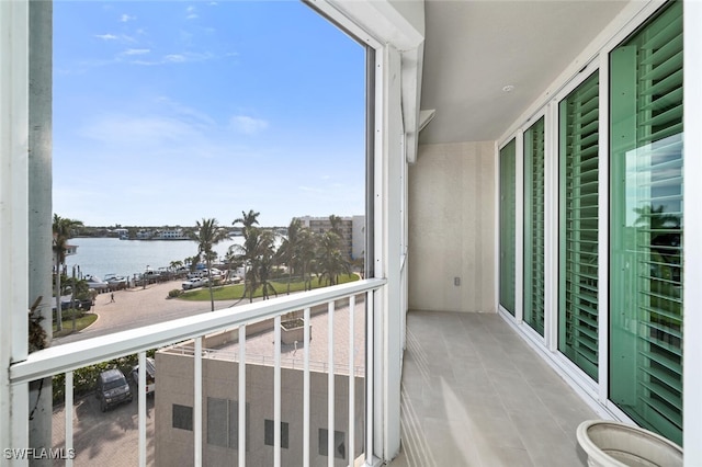 balcony featuring a water view