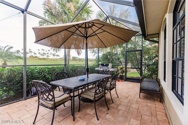 view of patio with glass enclosure