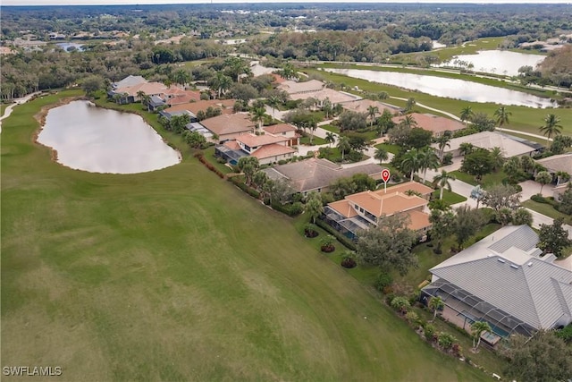 drone / aerial view with a water view