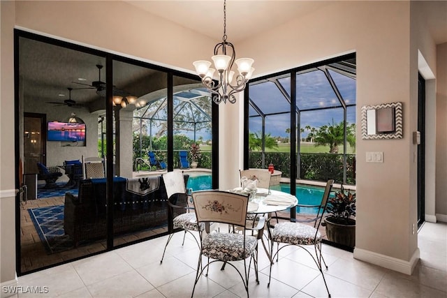 tiled dining space featuring ceiling fan