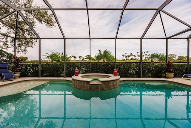 view of pool featuring an in ground hot tub and glass enclosure