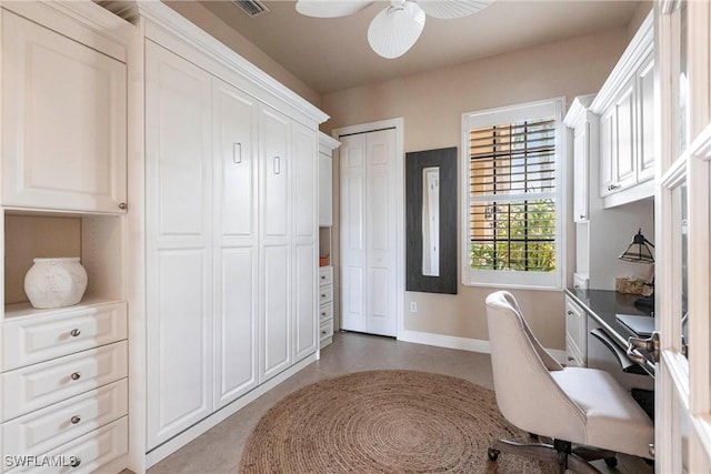 home office featuring visible vents, a ceiling fan, and baseboards