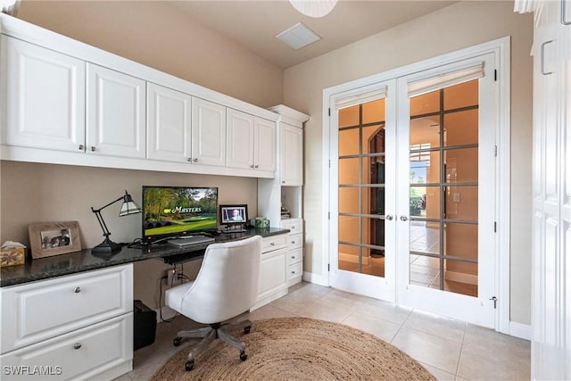 home office featuring baseboards, light tile patterned flooring, french doors, and built in study area