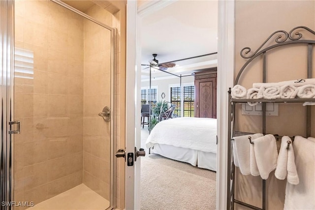 full bathroom featuring a ceiling fan, a shower stall, and ensuite bath