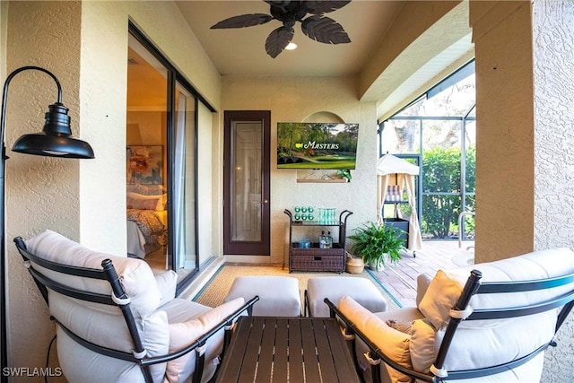 sunroom with a ceiling fan