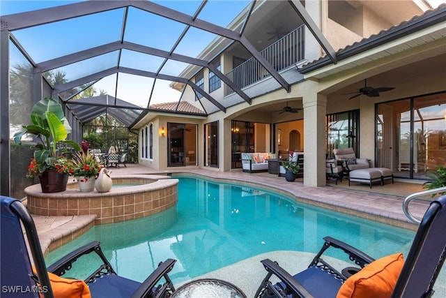 outdoor pool featuring glass enclosure, a patio area, outdoor lounge area, and a ceiling fan