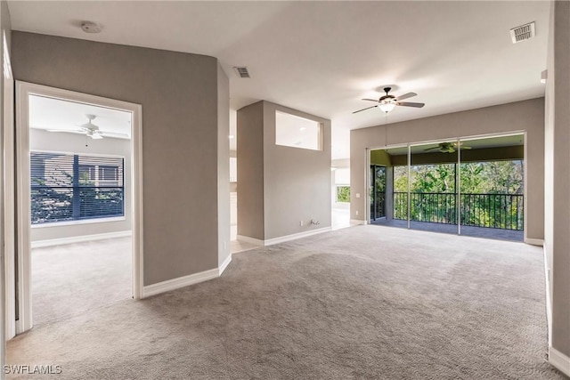 unfurnished room featuring light colored carpet and ceiling fan