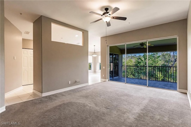 unfurnished living room with ceiling fan and light colored carpet