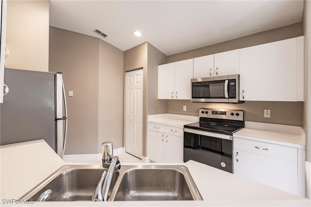 kitchen featuring white cabinets, sink, and stainless steel appliances