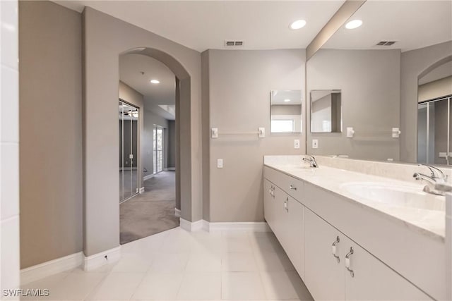 bathroom featuring tile patterned floors, plenty of natural light, and vanity