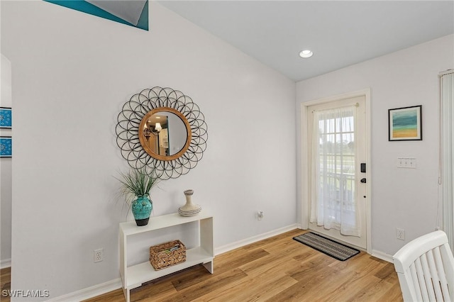 foyer entrance with light hardwood / wood-style flooring