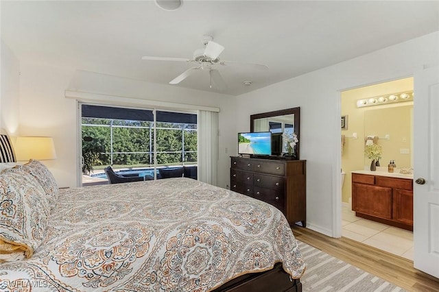 bedroom with ceiling fan, light hardwood / wood-style floors, and ensuite bath