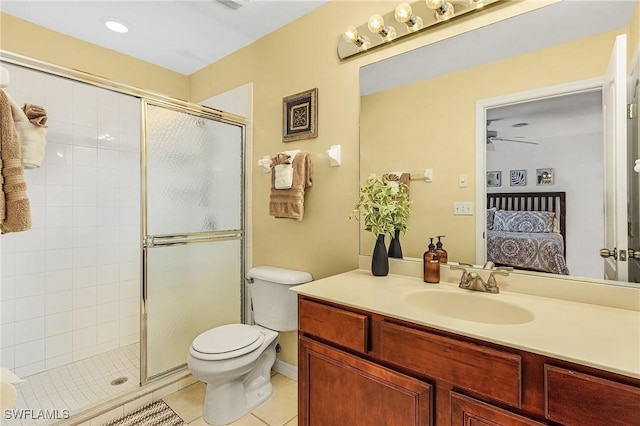 bathroom featuring tile patterned flooring, vanity, ceiling fan, and a shower with shower door