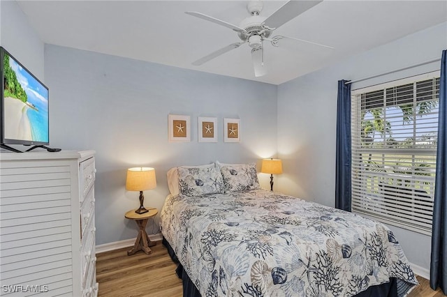 bedroom featuring ceiling fan and light hardwood / wood-style flooring