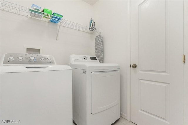 washroom featuring washer and dryer