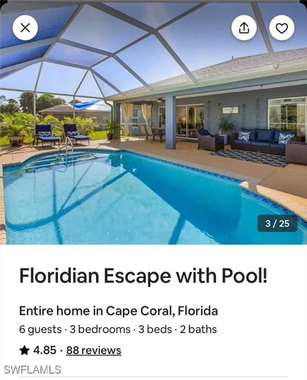 view of pool with an outdoor living space, a patio area, and a lanai