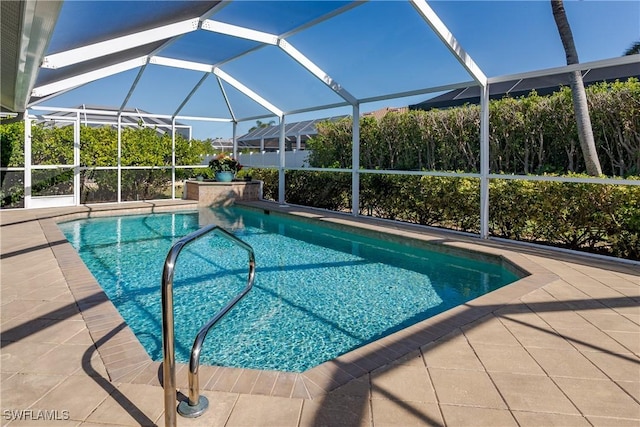 view of pool featuring a patio and a lanai