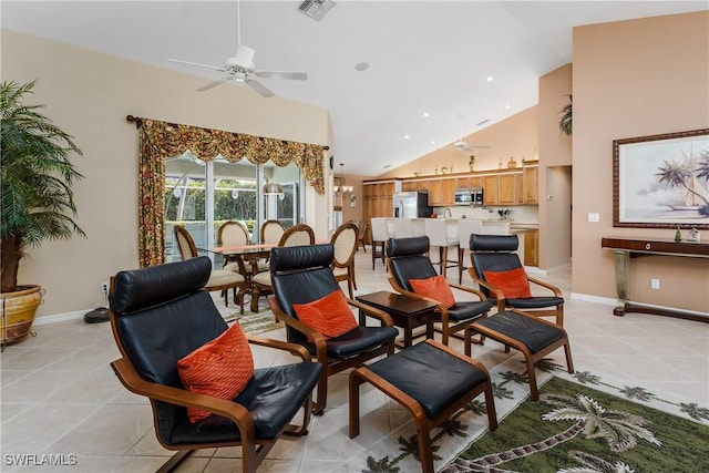 interior space featuring ceiling fan, light tile patterned floors, and high vaulted ceiling