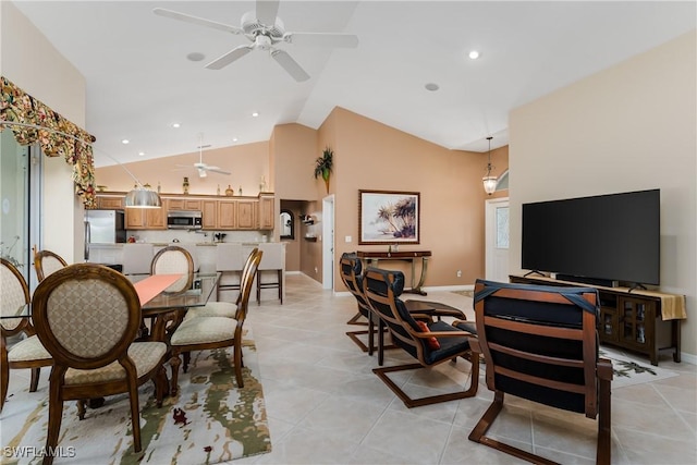 dining room with light tile patterned floors and lofted ceiling