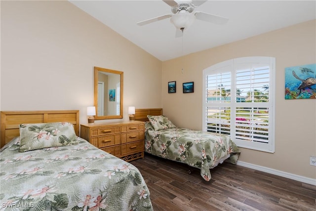 bedroom featuring ceiling fan, dark wood-type flooring, and vaulted ceiling