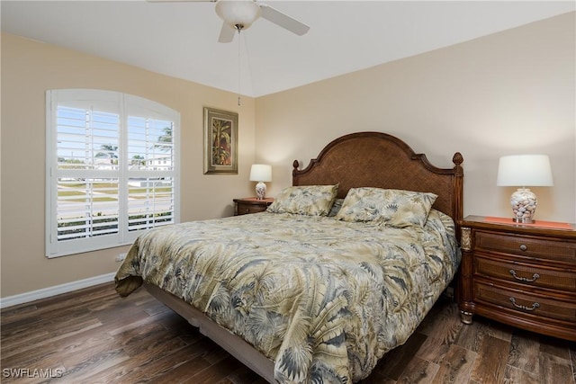 bedroom featuring dark hardwood / wood-style flooring and ceiling fan