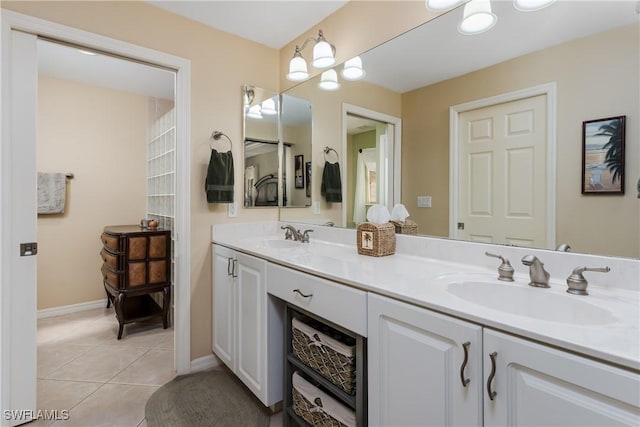 bathroom with tile patterned floors and vanity