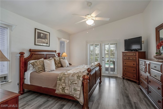 bedroom with ceiling fan, lofted ceiling, dark hardwood / wood-style floors, and access to outside