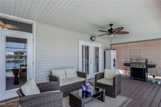 deck featuring a grill, outdoor lounge area, a ceiling fan, and french doors