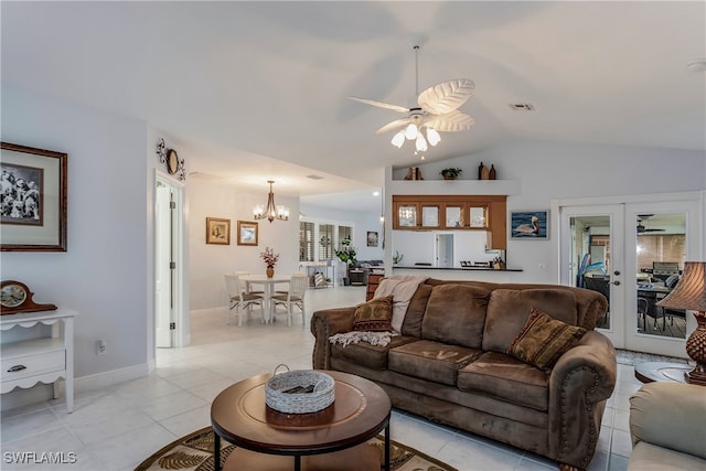 living room with light tile patterned floors, visible vents, lofted ceiling, french doors, and ceiling fan with notable chandelier