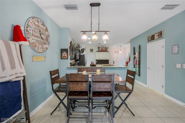 dining space with light tile patterned floors