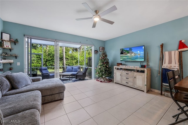 living room with ceiling fan and light tile patterned floors