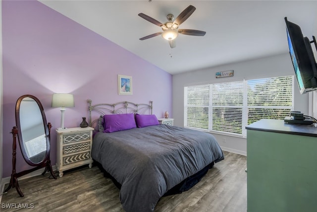 bedroom featuring ceiling fan, wood-type flooring, and vaulted ceiling