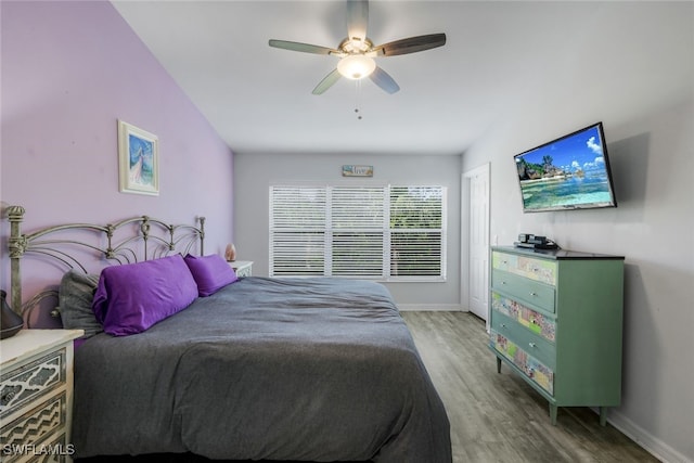 bedroom featuring hardwood / wood-style floors and ceiling fan