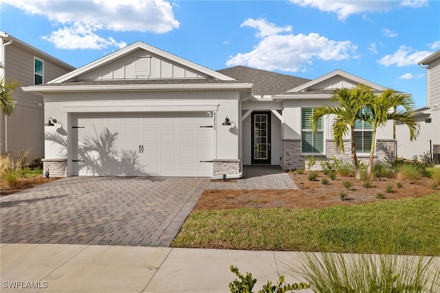 view of front facade featuring a front yard and a garage