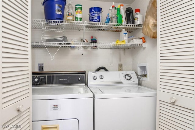 laundry area with independent washer and dryer