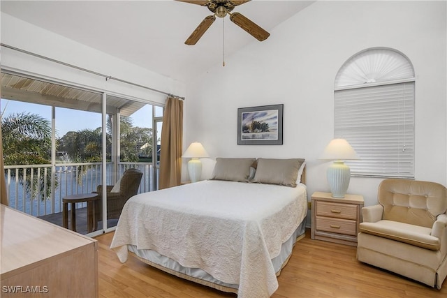 bedroom featuring access to exterior, light wood-type flooring, a water view, and ceiling fan