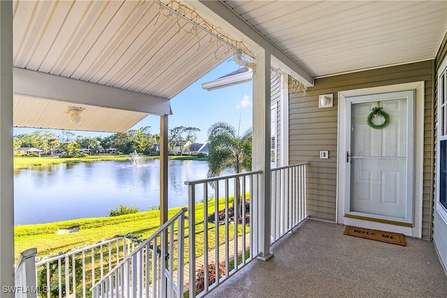 doorway to property with a water view