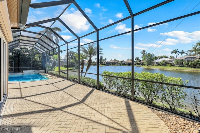 exterior space with a water view and a lanai