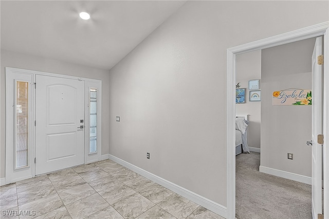 foyer entrance with light carpet